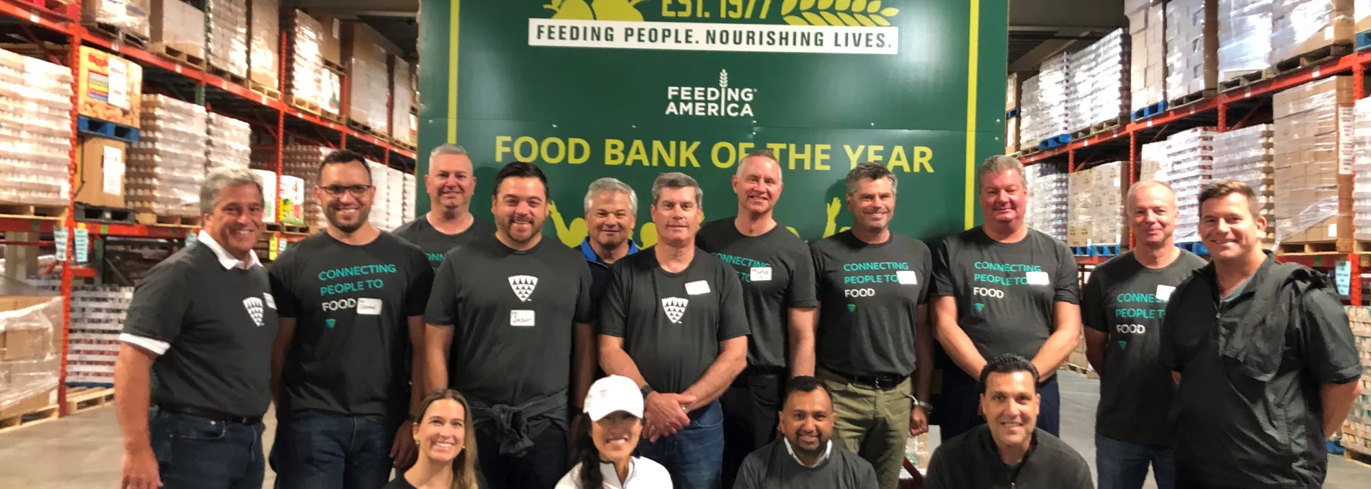 Executive team volunteering at food bank