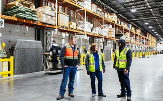 Photo of 3 employees inside a cold storage facility representing several locations in Latin America